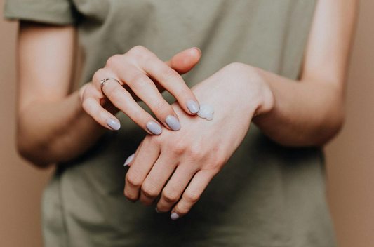 woman nails castor oil hand massage