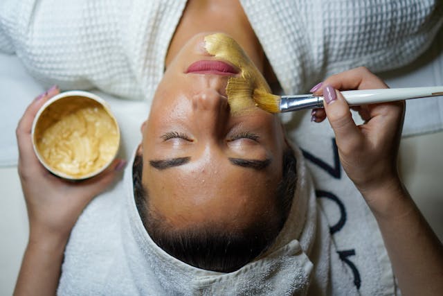 woman having facial with castor oil and honey