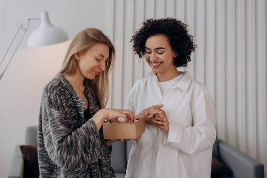 women looking into box