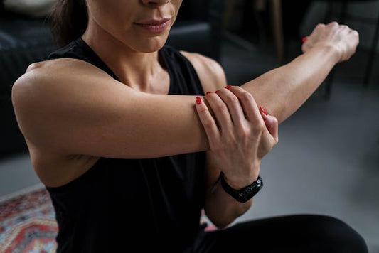 woman massaging her arm